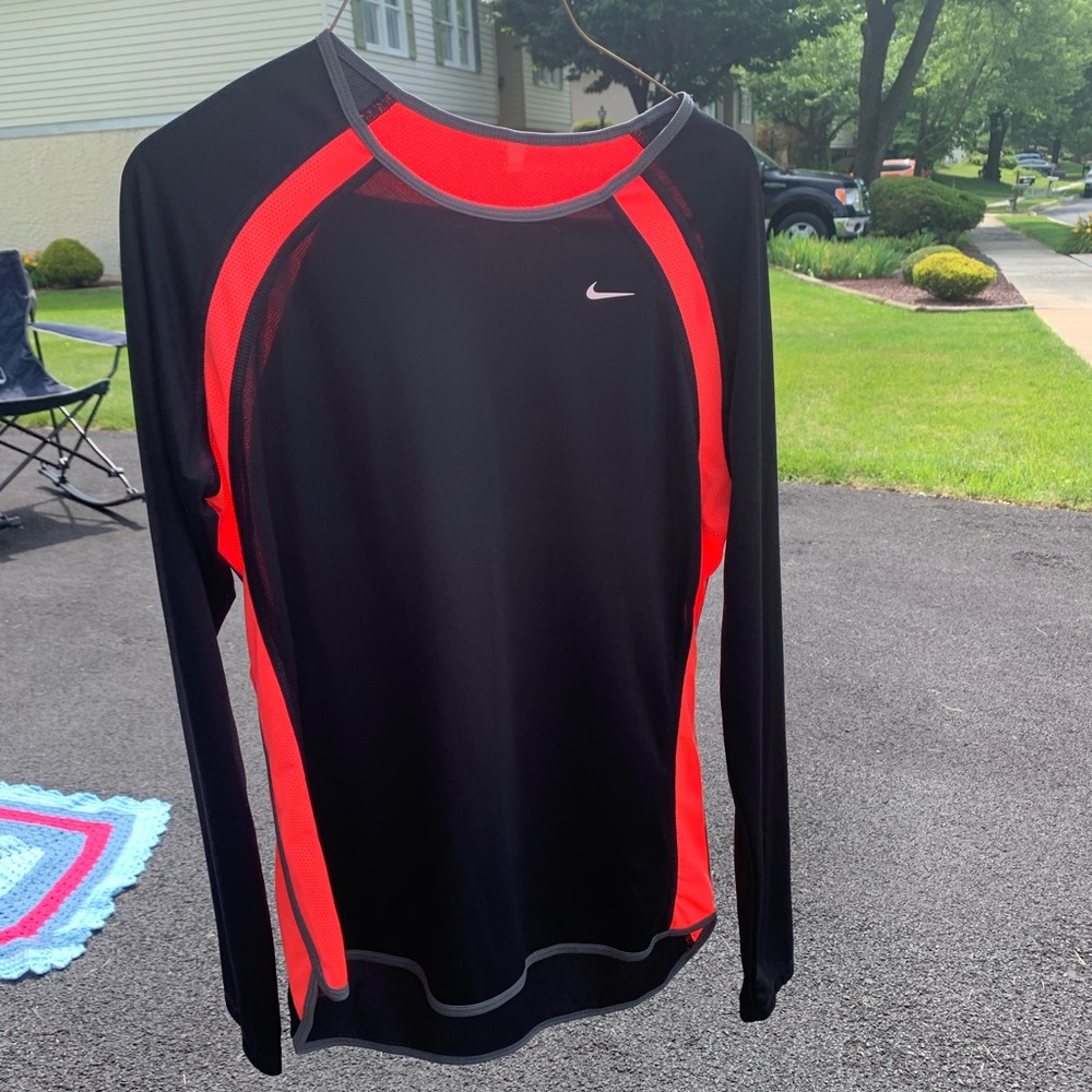 Black and Pink Nike shirt.